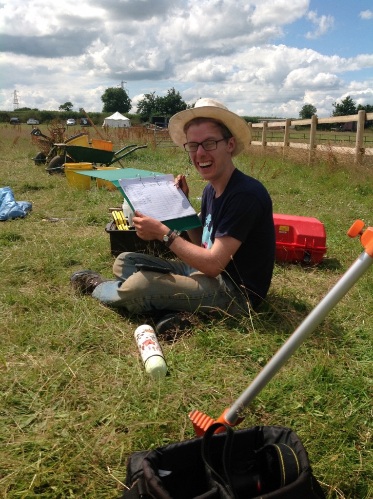 A happy George fills in the small finds register