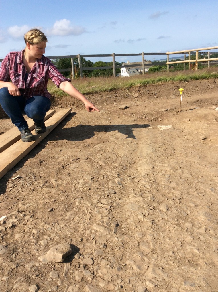 Danielle Wootton points out the wheel ruts in the Roman road 