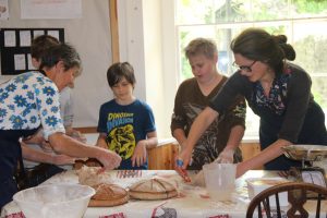 Breadmakers Emma and Iona with Sands school pupils